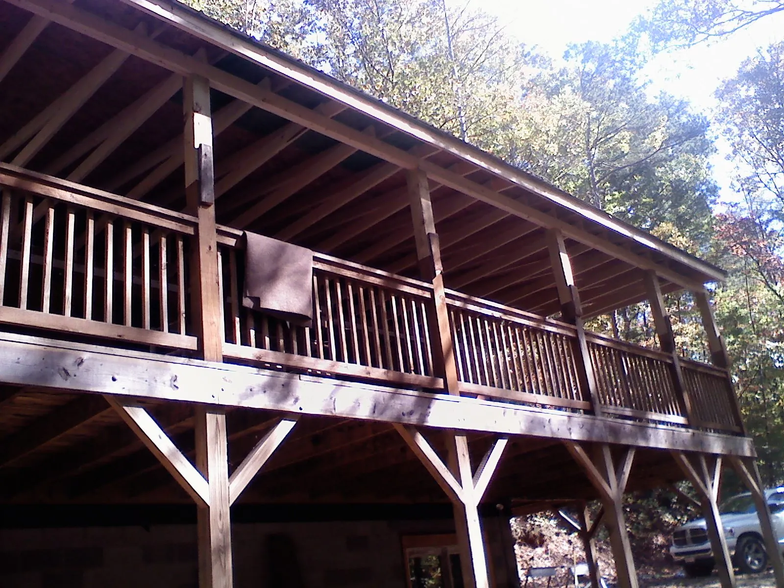 Timber framing under a new elevated porch and deck — Roof Leak Repair in Posen by Roofing Brothers
